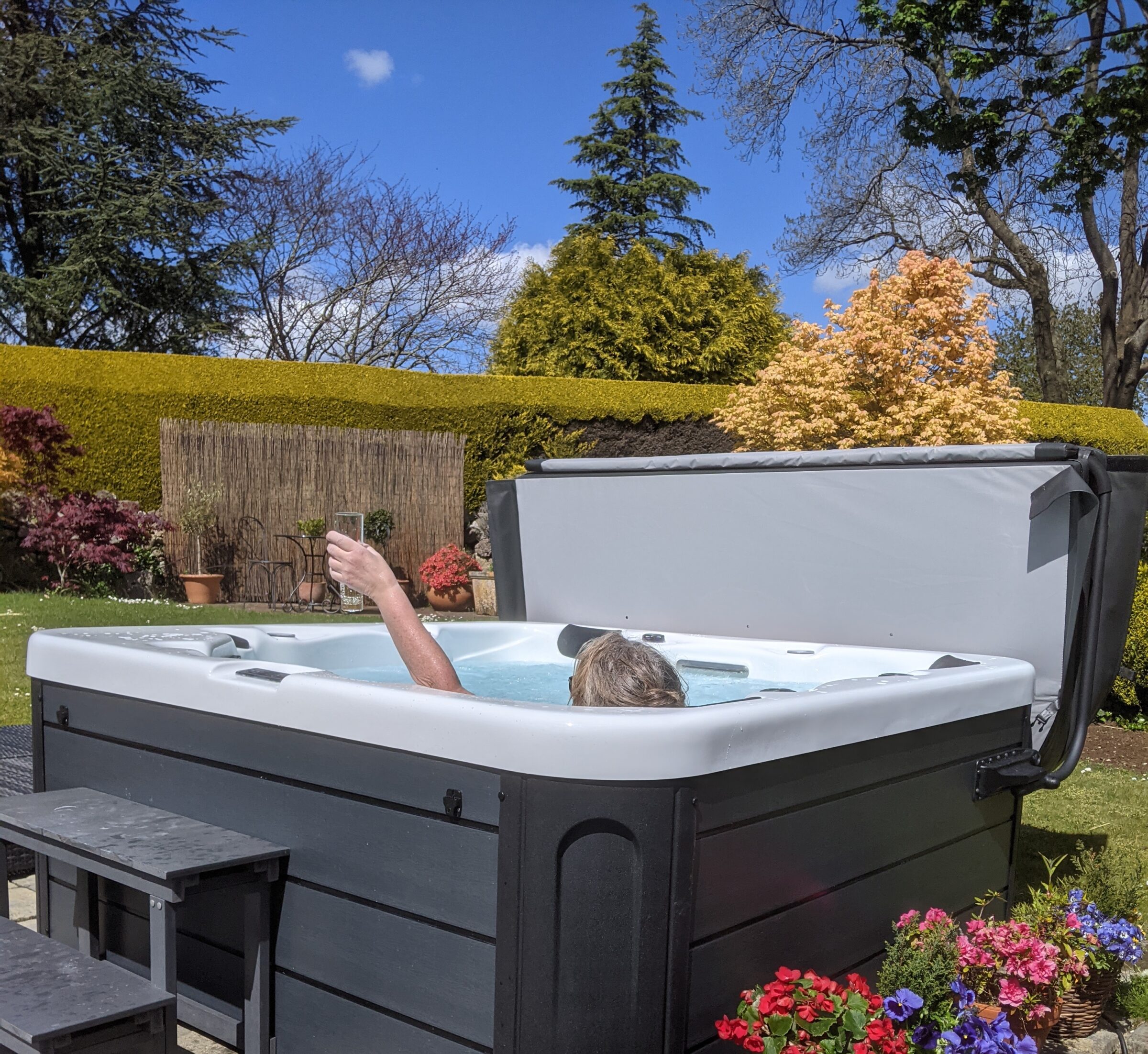 Customer enjoying hot tub and prosecco