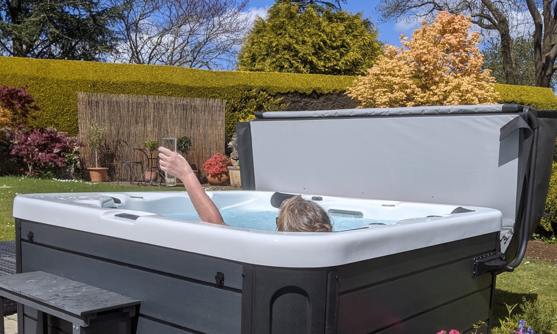 Customer enjoying hot tub and prosecco crop